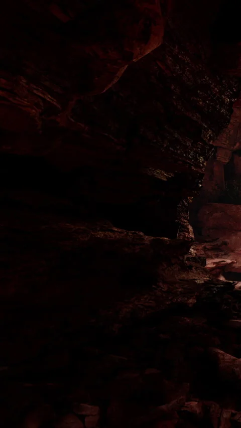 Exploring a dark cave with rocky walls and distant light at the end Stock Footage 340262025