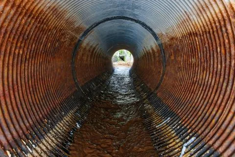 Exploring the Depths of a Rusty Drainage Pipe Stock Photos