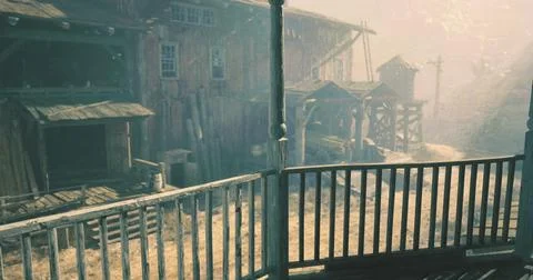 Exploring a deserted town with rustic buildings and misty atmosphere Ilustración de archivo