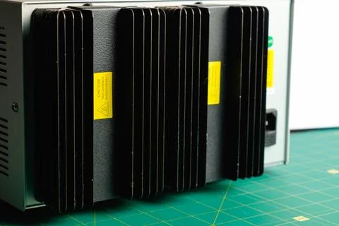 Exploring the detailed design of an electronic device on a green workspace Stock Photos