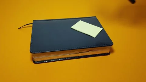 Exploring Details: Notebook Magnifying Glass Stock-Footage 303488346