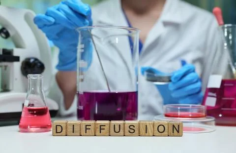 Exploring the diffusion process in a lab with colorful solutions to enhance Fotos de archivo