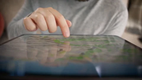 Exploring Digital Maps on a Tablet Device A CloseUp Detailed View Stock Footage 283599233