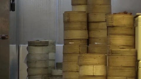 Exploring dim sum preparations in a bustling kitchen Stock Footage 323790143