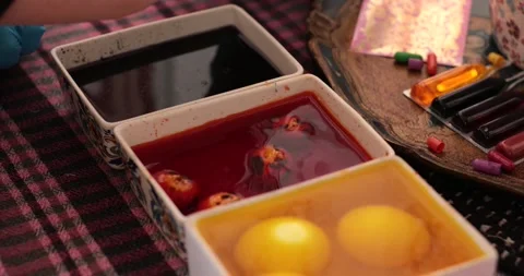 Exploring Easter eggs and the colorful step of egg painting process with vibrant Stock Footage 306067636