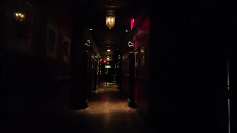 Exploring the Eerie Corridor of a Dark Restaurant at Night Stock Footage 318736637