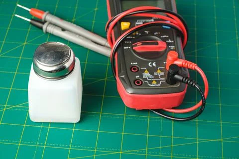 Exploring electrical measurements with tools on a vibrant work surface Stock Photos