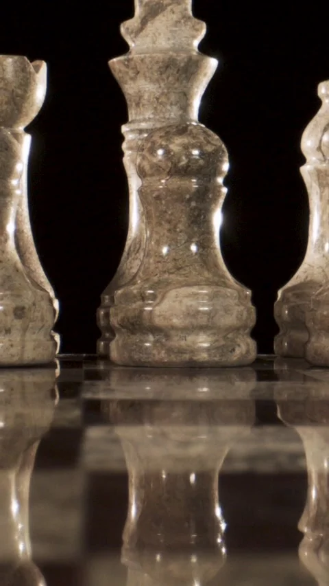 Exploring the Elegance of Glass Chess Pieces in Artistic Arrangement Stock Footage 338142166