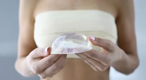 Exploring the elegance of silicone breast implants during a consultation in a Stock Photos