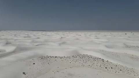 Exploring the endless sand dunes of a vast desert landscape Stock Footage 312675221