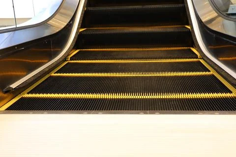 Exploring Escalator Steps as a Key Element in Modern Interior Design and Stock Photos