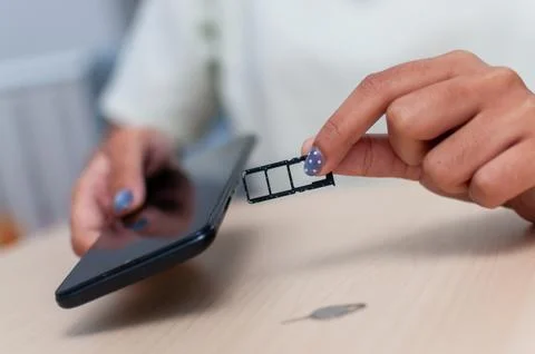 Exploring everyday life sim card insertion in mobile phones with close-up t.. Stock Photos