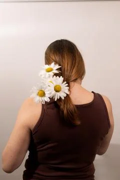 Exploring Femininity Through Self-Care and Natural Beauty With Flowers in Hair Stock Photos