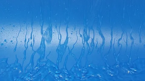 Exploring flowing water on an abstract blue background in four frames Stock Footage 338120141