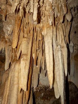Exploring flowstone and cave formations in Sakalavas cave located within Stock Photos