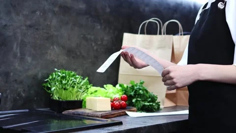 Exploring fresh ingredients and planning a delightful meal at home Vídeos de archivo 296315873