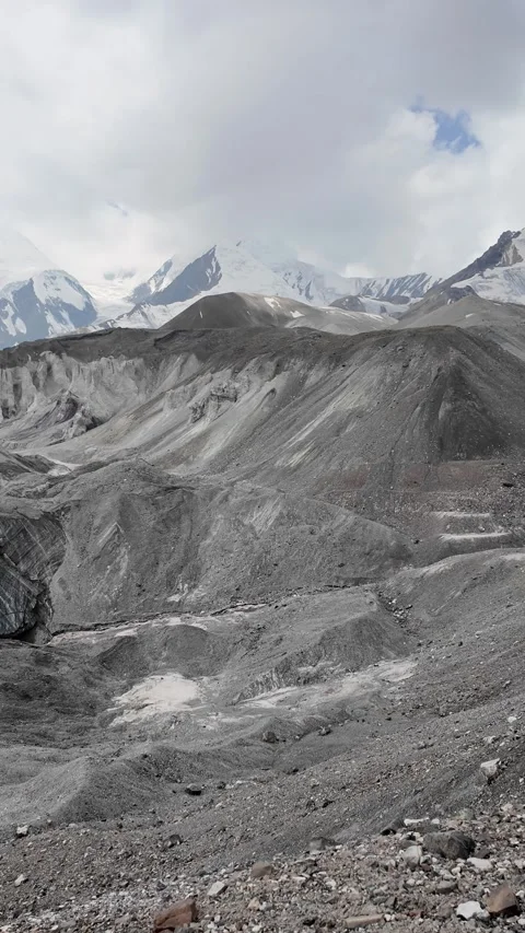 Exploring a glacier trail with rocky paths and mountain views Stock Footage 345572778