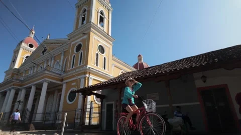 Exploring Granada on a Bicycle in the Vibrant Streets of Nicaragua Stock Footage 300232788