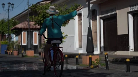 Exploring Granada on a Bike While Enjoying the Warm Nicaraguan Sun Stock Footage 303825736
