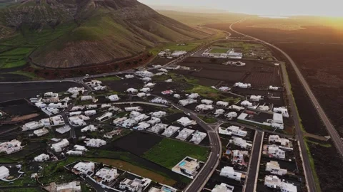Exploring the green hills and white houses of Lanzarote during sunset 스톡 동영상 331799196