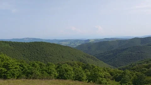 Exploring the green mountains and meadows under blue sky Vidéo 315360120
