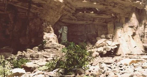 Exploring a hidden cave with rock formations and vegetation in a remote area Stock Illustration