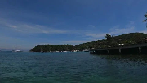 Exploring Hidden Coves: Boat Journey at a Tropical Haven Stock Footage 303156010