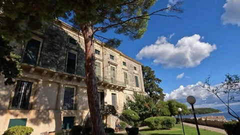 Exploring the historic architecture of Corfu on a sunny day by the waterfront Video stock 285596239
