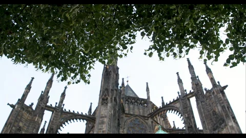 Exploring the historic architecture of Prague beneath the leafy canopy on a Stock-Footage 283795428