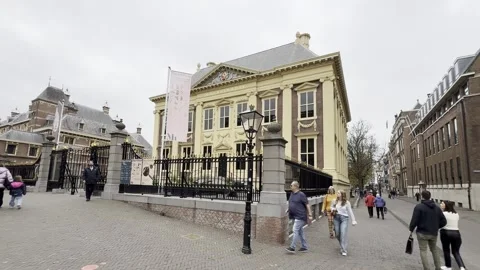 Exploring a historic building in Amsterdam on a cloudy day Stock Footage 306618018
