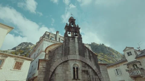 Exploring the historic charm of Kotor with stunning mountain views Stock Footage 296190139