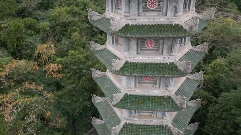 Exploring a historic pagoda in a lush forest during the afternoon Stock Footage 310069079