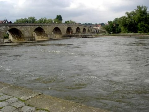 Exploring the Historic Stone Bridge Over the Danube River in Regensburg, Ge.. Stock Photos