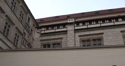Exploring historical architecture in a stone building at sunset in a quiet town 库存影片 283795769