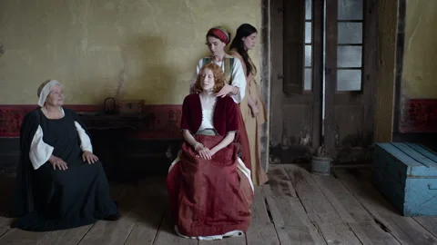 Exploring a historical role play in a quiet room with costumes and characters Stock Footage 327942622