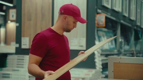 Exploring home improvement options at a local shop in the early afternoon Stock Footage 293672721