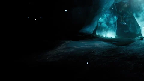 Exploring an ice cave with light illuminating the icy walls and shadows Stock Footage 344955389