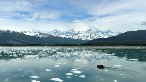 Exploring icebergs in a zodiak boat on a chilly day in the Arctic region  Stock Footage 338344979