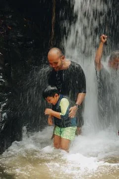 Exploring Indonesia's Refreshing Mini Waterfall (Curug Leuwi Hejo) Stock Photos