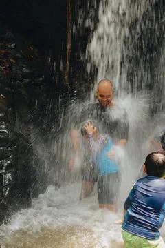 Exploring Indonesia's Refreshing Mini Waterfall (Curug Leuwi Hejo) Stock Photos