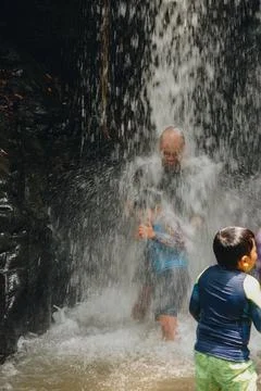 Exploring Indonesia's Refreshing Mini Waterfall (Curug Leuwi Hejo) Stock Photos