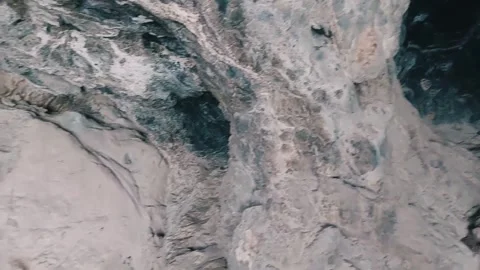 Exploring The Inner Rock Formations Of A Large Deep Cave Stock Footage 333611870