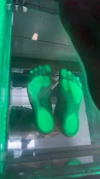 Exploring Innovative Foot Wellness Technologies: Illuminated Footprint Display Stock Photos