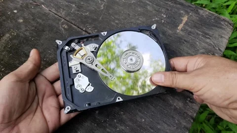 Exploring the inside of a hard drive in an outdoor setting with hands-on di.. Stock Footage 296425216