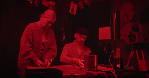 Exploring the intricate darkroom photography process alongside skilled chemists Video stock 305083918