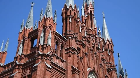 Exploring the intricate details of a stunning red brick cathedral Stock Footage 302902004