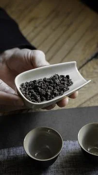 Exploring the Intricate Elements of Tea Ceremony Featuring Herbal Leaves and Stockfoto's