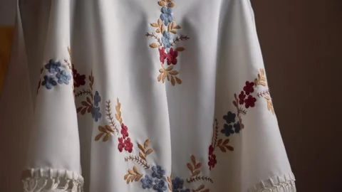 Exploring intricate hand-embroidered textile designs with floral patterns Stock Footage 289548854