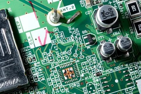 Exploring the intricate pathways of a green circuit board 写真素材