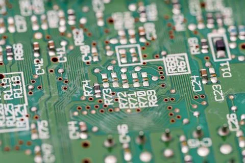 Exploring the intricate patterns of a modern, green circuit board up close Stock Photos